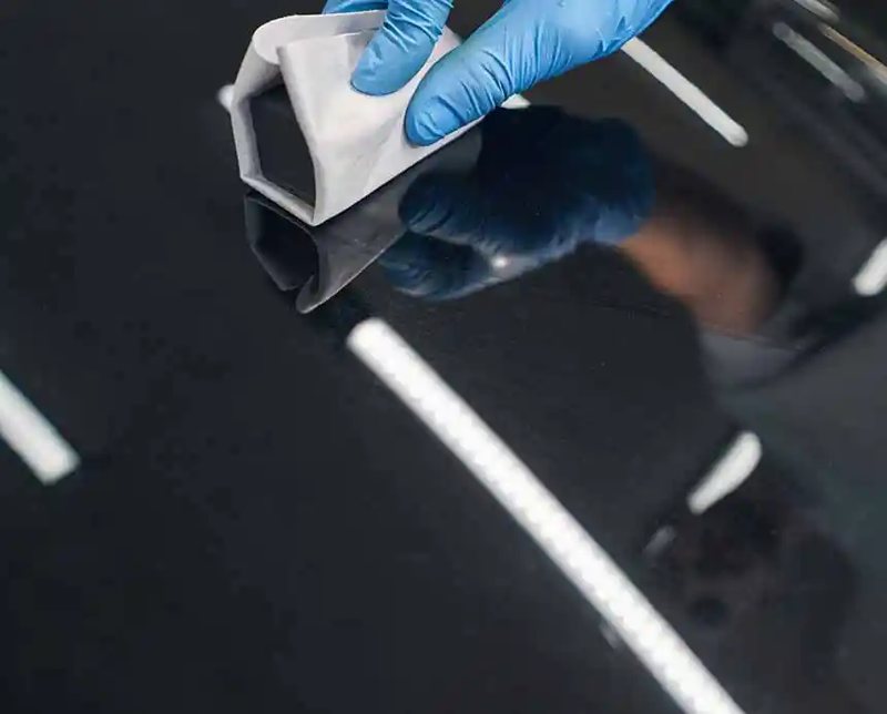 Ceramic coating being applied to a car at Florida Auto Ceramics in Jupiter